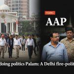 Firefighters at a Palam fire site, with political banners in the background symbolizing political discourse.